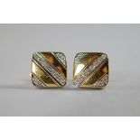A pair of 18ct gold and diamond set gentleman's cufflinks, of square form set with diagonal rows