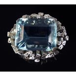 A large and impressive aquamarine and diamond set pendant / brooch, mid 1970s, the mount, of