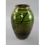 Michael Cardew OBE, British, 1901-1983, a tall green slipware Wenford Bridge earthenware vase,