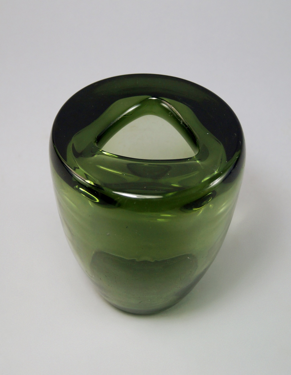 A Leerdam green glass vase, c. 1940, of waisted form with a triangular aperture, etched mark to