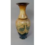 Florence Elizabeth Barlow, British, fl. 1873-1909, a tall Doulton baluster vase with long neck,