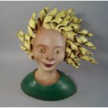 Tessa Fuchs, British 1936-2012, earthenware portrait bust of a girl with curly blond hair,