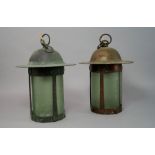 A pair of Arts and Crafts lanterns, each with ring finial above a domed hammer top, with cylindrical