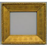 An English Gilded Oak and Composition Watts Type Frame, late 19th century, of wedge shape with