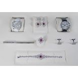 An 18ct white gold, diamond and ruby set