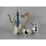 A silver three piece coffee set, London