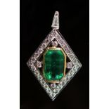 A 14ct white and yellow gold, emerald an