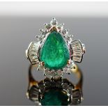 An 18ct gold, emerald and diamond ring,