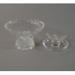 Lalique, a clear glass tazza, supported on a pedestal of four chicks, on circular pad base, etched