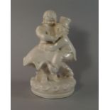 A European pottery figure group of a dancing couple, 20th century, on a circular base, 33cm high