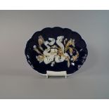 A Meissen shell form porcelain dish, late 19th/early 20th century, glazed and gilt in blue raised