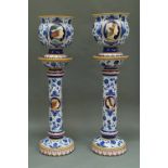 A pair of Italian tin glazed earthenware jardinieres and stands, 20th century, painted with