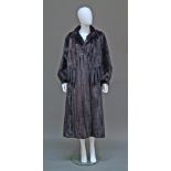 A fine quality full length dark mink coat, collarless, with tie neck, trimmed in mink tails, the