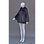 A Blackglama dark ranch mink jacket, retailed by Zwirn, London, wide collar and button through