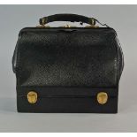 Cartier: A black leather travelling doctors style bag by Cartier, early 20th century, with fitted