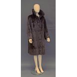 A mid chestnut brown fur coat, wide collar and lapels and concealed fastenings, approx UK size 12/