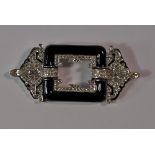 An Art Deco style black enamel and crystal set brooch by Ciner, c.1980s, approx 8.5cm wide.