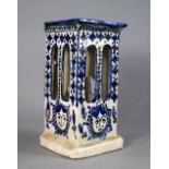 A Persian style blue and white pottery l