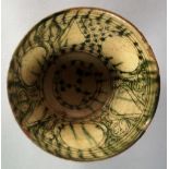 A Nishapur green splash glazed bowl, Cir