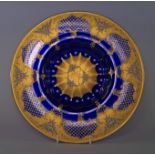 A Vecchia Murano glass dish, 20th century, painted and gilt with reserves of flowers on gilt