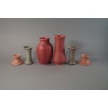 A pair of Royal Lancastrian pink mottled pottery candlesticks, 20th century, stamped to base, 7cm