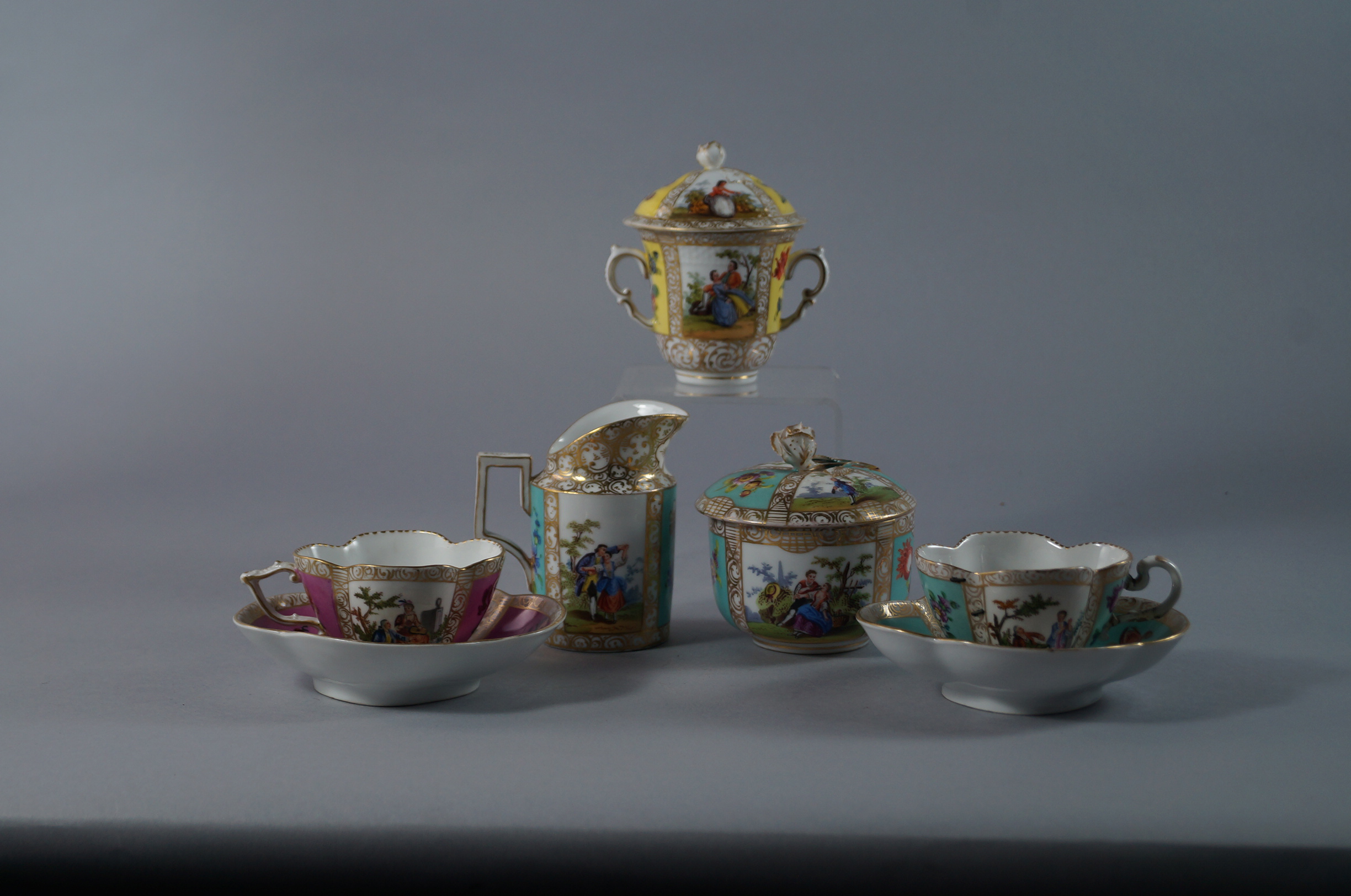 Two Dresden porcelain cabinet cups and saucers, late 19th/early 20th century, of quatrefoil lobed