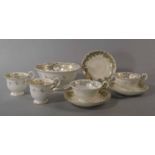 A Victorian part tea service possibly Coalport, of adelaide shape and with gilt lined scrolls upon