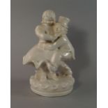 A European pottery figure group of a dancing couple, 20th century, on a circular base,