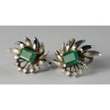 A pair of 18ct white gold, emerald and diamond set earrings, with central square cut emerald and
