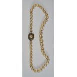 A single graduated row cultured pearl necklace, with pearl and diamond set yellow metal (tests as