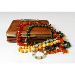 A quantity of beads to include a dark green jade bead necklace with 14ct gold clasp,