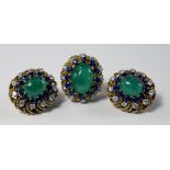 An emerald, sapphire and diamond cluster ring and matching clip earrings, c.1970, the large