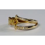 An 18ct gold and diamond set panther ring, Carrera y Carrera, the panther with ruby set eyes,