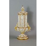 A Worcester Parian porcelain and gilt reticulated vase and cover, early 20th century, the cover with