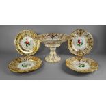 An English porcelain dessert service, 19th century, painted and gilded to the centres with sprays of