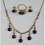 A 9ct gold and amethyst fringe necklace, with scrolled links and round cut amethyst stones, approx