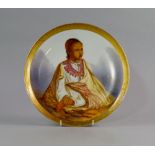 An English porcelain plate, 19th century, painted to the centre with an Orientalist scene of a
