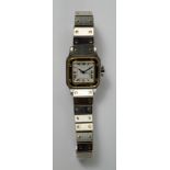 Cartier: A ladies Santos automatic wrist watch, 1981, stainless steel with 18ct gold bezel, number