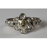 A diamond and yellow diamond ring, early 20th century, of floret design, with diamond mounted