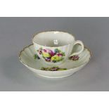 A Worcester porcelain cup and saucer, 18th century, with scalloped rims and reeded body, painted and
