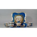A Sevres porcelain cabaret set, 19th century, painted and gilt with  reserves of cherubs, flanking