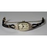 A platinum and diamond cased ladies cocktail watch, c.1920s, fitted with black plaited strap, the