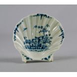 A Worcester blue and white shell sweetmeat dish, circa 1756, moulded as a scallop shell, painted