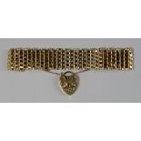 A 9ct gold mesh bracelet with padlock clasp, approx 19.5cm x 2cm, approx 27g.  CONDITION REPORT: