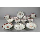 A collection of English porcelain tea bowls and saucers, some of New Hall type, 18th and later,