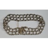 A white metal and diamond set bracelet, early 20th century, formed of old mine cut diamond set