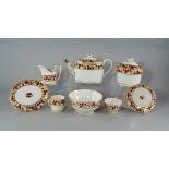 A English porcelain tea service, early/mid 19th century, painted and gilt with bands of strawberries
