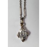 A single stone diamond pendant, the oval cut diamond approx 0.50ct set in white metal with diamond