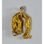 An 18ct gold and diamond set panther pendant, Carrera y Carrera, the panther holding a single