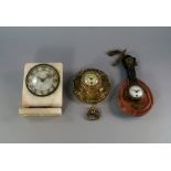 A French onyx and gilt metal mounted mantel clock, inset with jewels,